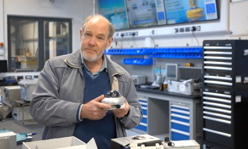 John wood from peak design holding a sensor in a laboratory